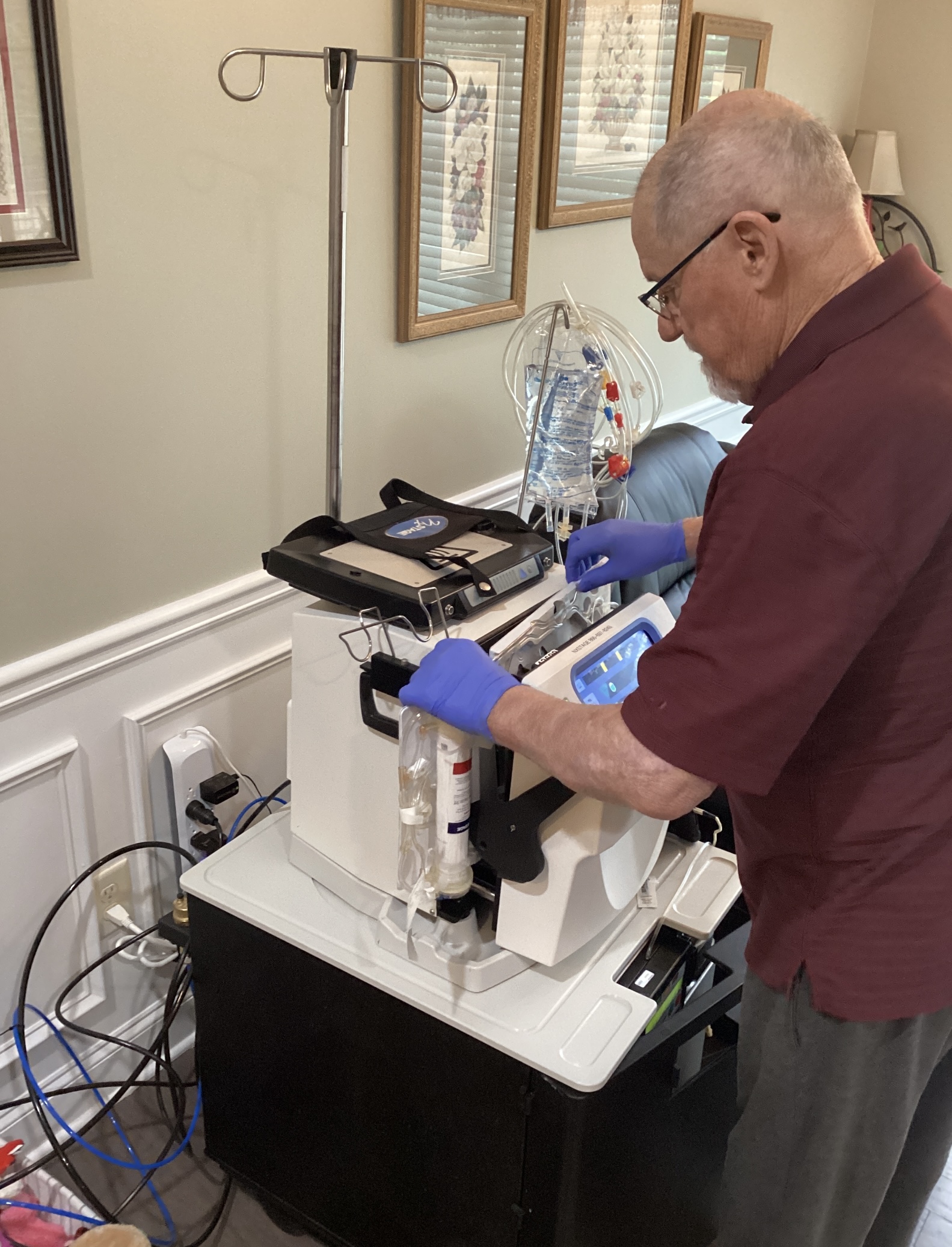 Dad performing home hemodialysis setup
